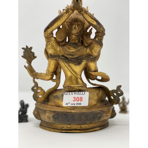 308 - A gilt figure of a Tibetan Buddha, ht 23cm; other similar miniature figures