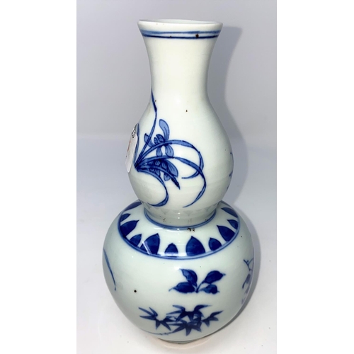 315 - A Chinese blue and white double gourd vase, ht 19.5cm and a Chinese blue and white baluster vase (re... 
