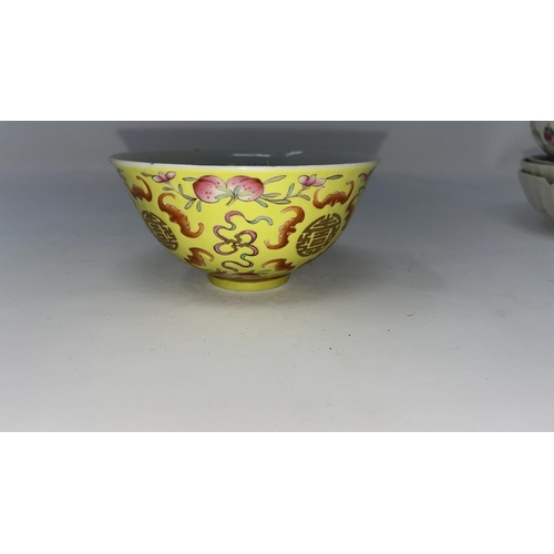 315a - A Chinese yellow glaze tea bowl with 4 character mark to base, d. 9cm; a similar tea cup (restored);... 