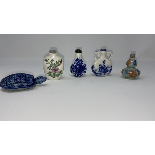 330 - A Chinese small blue and white moon vase; 4 other snuff bottles