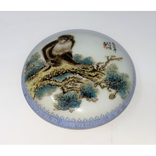 361B - A Chinese porcelain lidded pot decorated with a monkey, mark to base, d 10.5cm