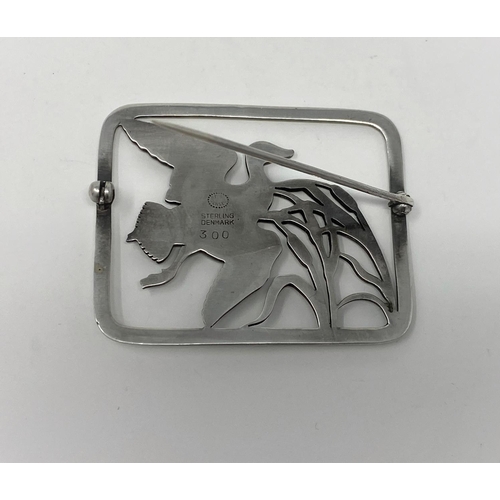 402 - A Georg Jensen silver brooch, pierced rounded rectangular shape, a duck flying past bulrushes, name ... 