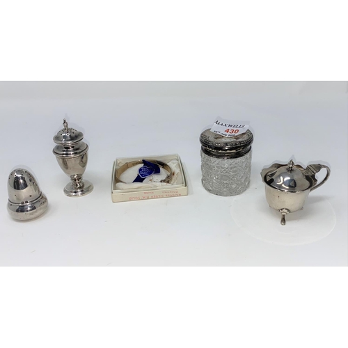 430 - 2 silver pepper pots; a silver mustard; silver top hair tidy and a silver bangle