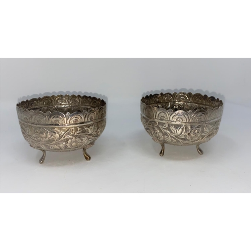 435 - A pair of Middle/Far Eastern white metal bowls with extensive embossed decoration, dia 9cm (unmarked... 