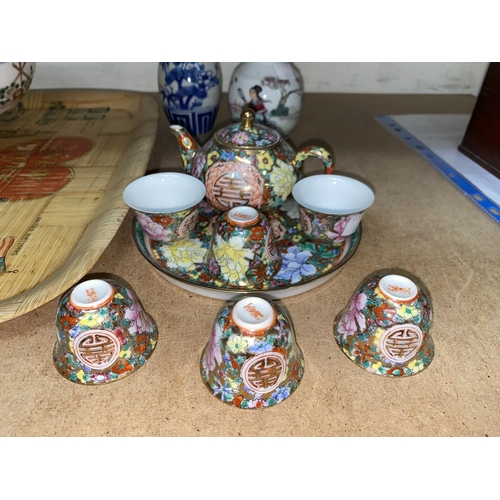 44 - A Chinese porcelain miniature tea set, other oriental items