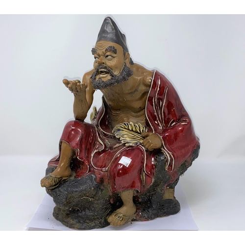 359B - A large Chinese figure of a seated man, height 37cm