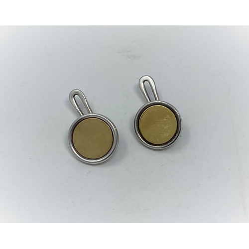 398 - A Georg Jensen pair of sterling silver cufflinks, circular with yellow metal disc, name impressed in... 