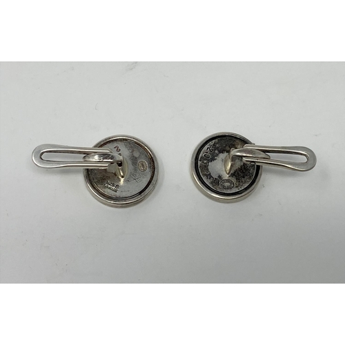 398 - A Georg Jensen pair of sterling silver cufflinks, circular with yellow metal disc, name impressed in... 