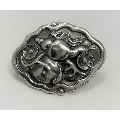 419 - A Georg Jensen sterling silver brooch, stamped Sterling Denmark numbered 279 featuring a snail among... 