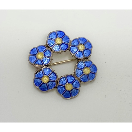 421 - A Volmer Bahner Danish sterling silver brooch enamel blue and yellow flowers in circle