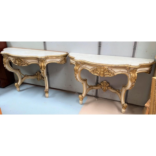 565 - A pair of 19th century console tables in the Rococco manner with scroll and accanthus supports in cr... 