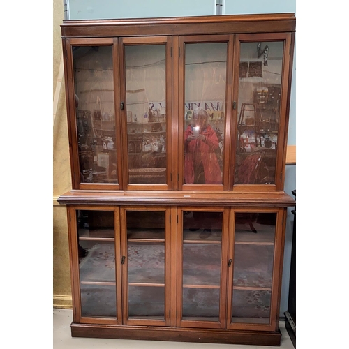 623 - An early 20th century mahogany library bookcase with 4 glazed doors to the upper section and base, w... 