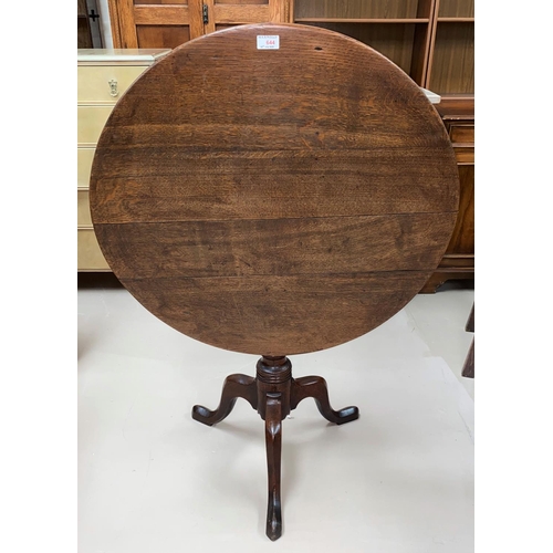 644 - A Georgian occasional table with circular top on turned column tripod base