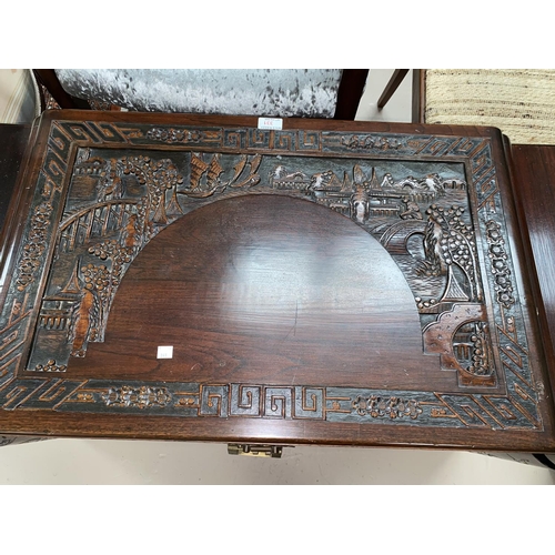 331 - A mid 20th century camphorwood chest with carved decoration