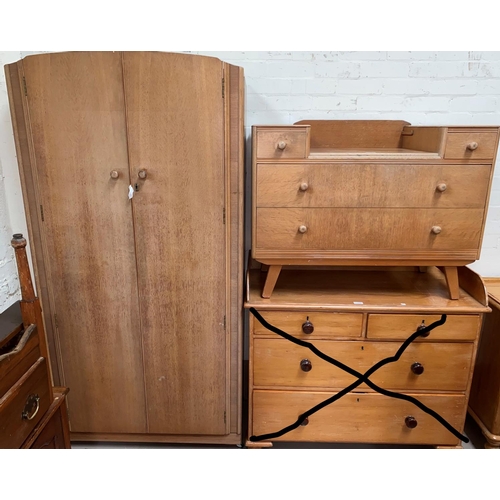 632 - A 1960's gent's light oak wardrobe, part fitted; a matching dressing table/desk