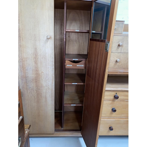 632 - A 1960's gent's light oak wardrobe, part fitted; a matching dressing table/desk