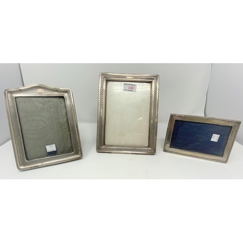 371 - Three hallmarked silver rectangular photo frames:  Birmingham 1915, 23 x 17 cm; Chester 1911, 19 x 1... 