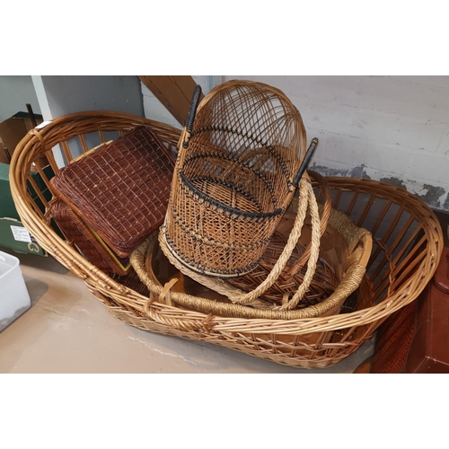 1C - A wicker crib and other basketware; a Lloyd Loom linen box
