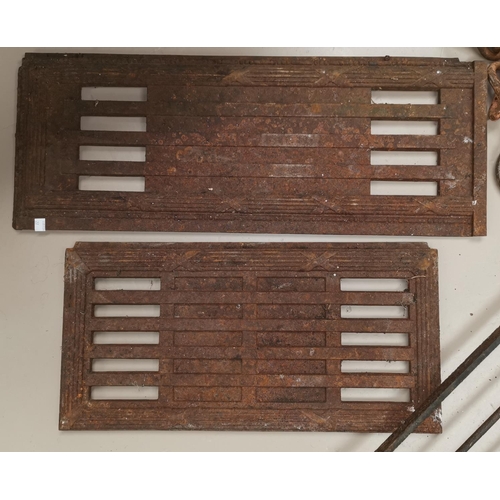 27 - A selection of heavy cast iron:  chain and hook; 2 panels with Georgian style decoration; a grate; e... 
