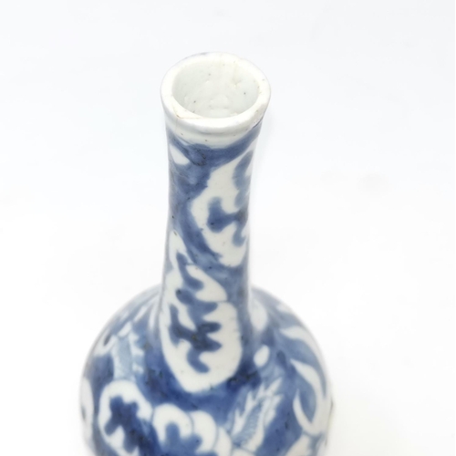 318B - A Chinese blue and white vase with long slender neck, decorated with dragons, 16cm height, (slight c... 