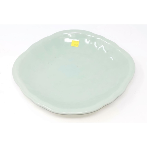 319B - A Chinese celadon glaze dish of oval form length 27cm