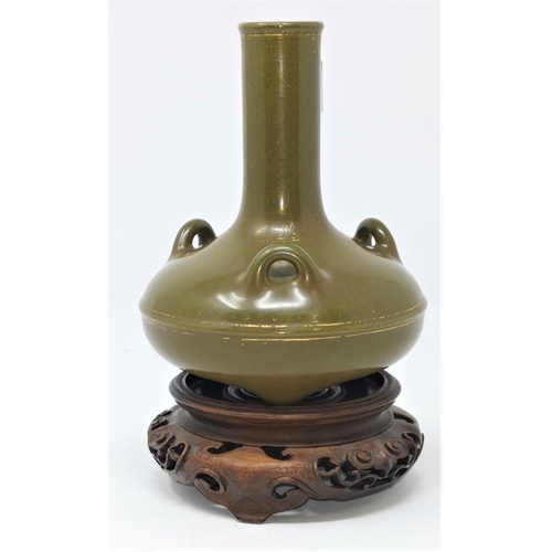 320 - A Chinese bronze gilded tea dust vase with impressed mark to base, on wooden stand height 14.5cm