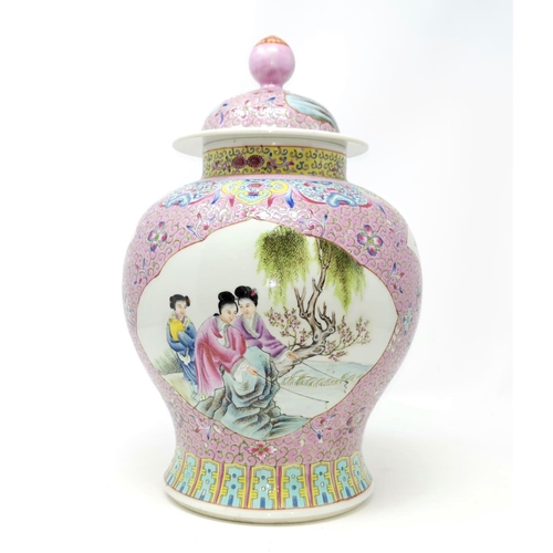 322A - A Chinese famille rose ground baluster lidded vase with seal mark to base 32cm height