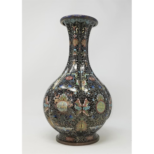 323A - A large Chinese cloisonne vase with raised section (some denting) height 34cm