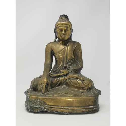 324 - A Chinese bronze and gilt figure of a Buddha in seated position height 33cm