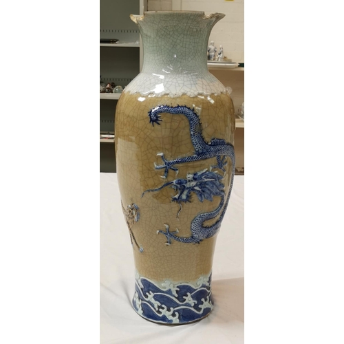 325C - A large Chinese crackle glaze floor vase decorated with a dragon and tiger in relief, seal mark to b... 