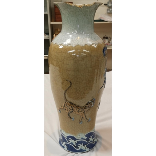 325C - A large Chinese crackle glaze floor vase decorated with a dragon and tiger in relief, seal mark to b... 