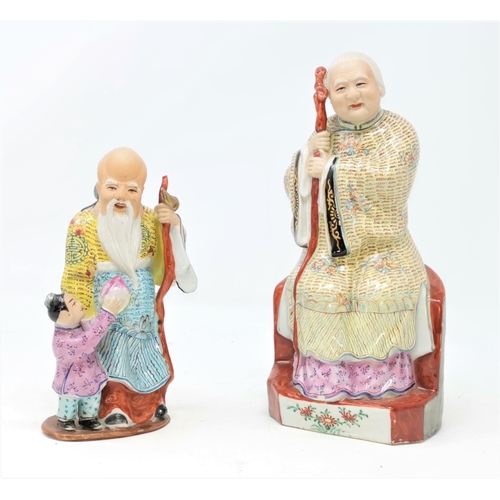 335 - A pair of modern Chinese porcelain figures of immortals; other carved hardwood animals and figures