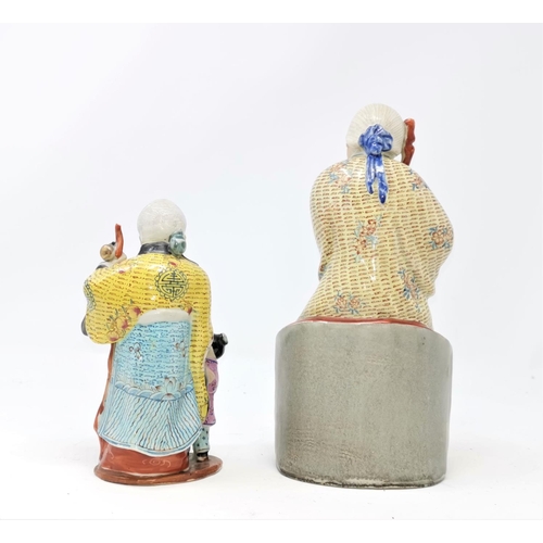 335 - A pair of modern Chinese porcelain figures of immortals; other carved hardwood animals and figures