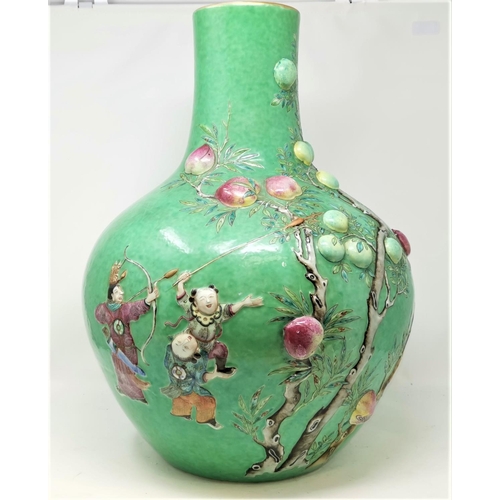 355 - A Large 19th century Chinese bottle vase in the Cantonese manor with green ground and highly detaile... 