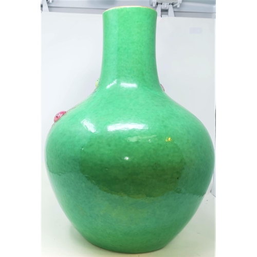 355 - A Large 19th century Chinese bottle vase in the Cantonese manor with green ground and highly detaile... 