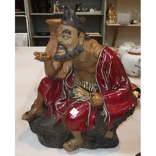 359B - A large Chinese figure of a seated man, height 37cm