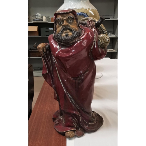 359c - A large Chinese figure of a man (restored), ht 47cm