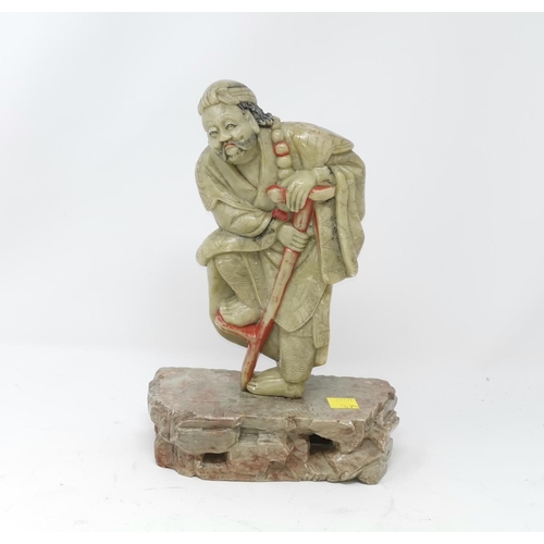 367A - A Chinese soapstone carving of a farmer on naturalistic stone base  height 26cm