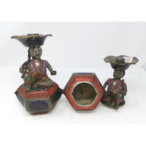 368 - A pair of unusual Chinese pewter candle sticks in the form of characters sat on box with space for i... 