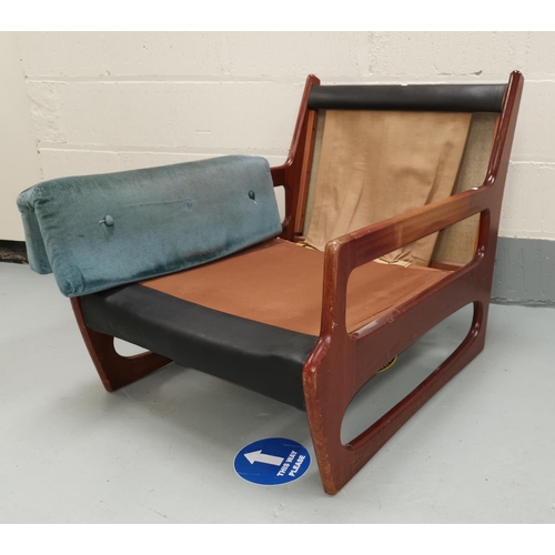 635 - A mid century teak G-Plan style armchair with vinyl backing, width 70 cm