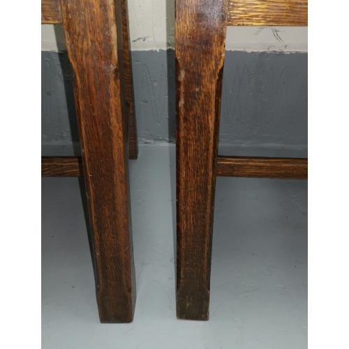 643 - A set of 4 oak dining chairs in the Arts & Crafts style, with high backs, on chamfered legs and supp... 