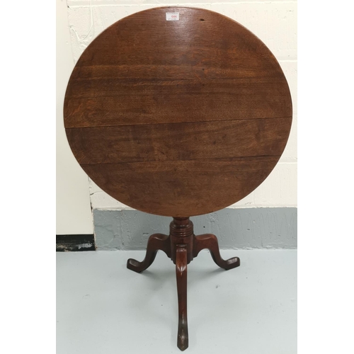 644 - A Georgian occasional table with circular top on turned column tripod base