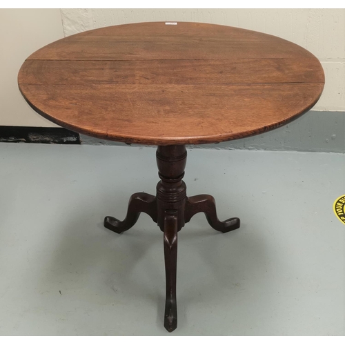 644 - A Georgian occasional table with circular top on turned column tripod base