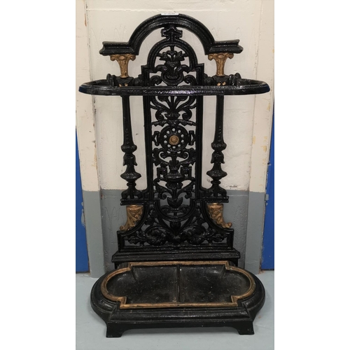 646 - A black and gilt painted cast iron stick stand