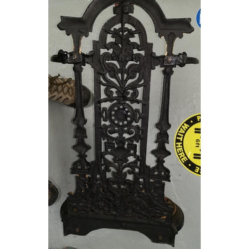 646 - A black and gilt painted cast iron stick stand