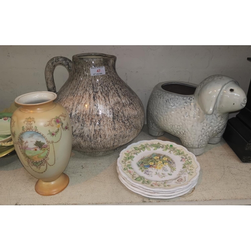 47 - A large pottery wine jug/pitcher, a vase, other decorative items