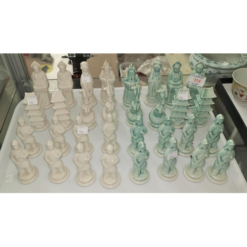 354 - An early/mid 20th century Chinese chess set in green and white porcelain depicting oriental figures ... 