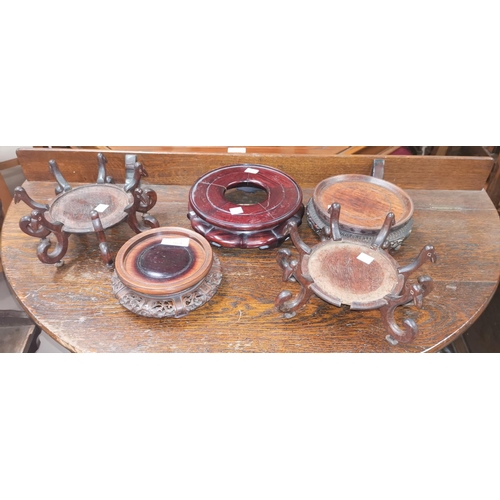 364 - Five various oriental hardwood stands