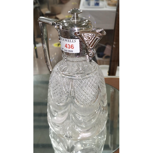 436 - A cut glass claret jug with chased silver plated handle, rim and lid