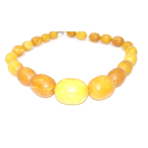 455A - An unpolished amber necklace, 78gm, largest bead 3cm, overall length 46cm